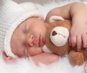 How should the newborn sleep