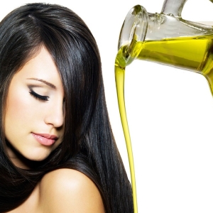 Stock Foto Hair mask with olive oil, how to use