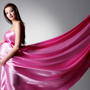 Stock Foto Evening dresses for pregnant women