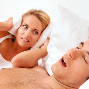 Photo Why does a person snoring?