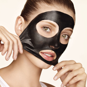 Stock Foto Mask from black dots with activated carbon