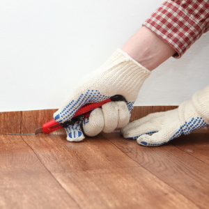 Stock Foto How to lay linoleum on wooden floor