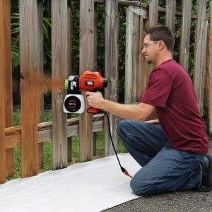 Stock Foto How to paint a wooden fence