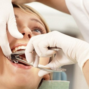 Foto hur man tar bort smärta efter att du tar bort tanden